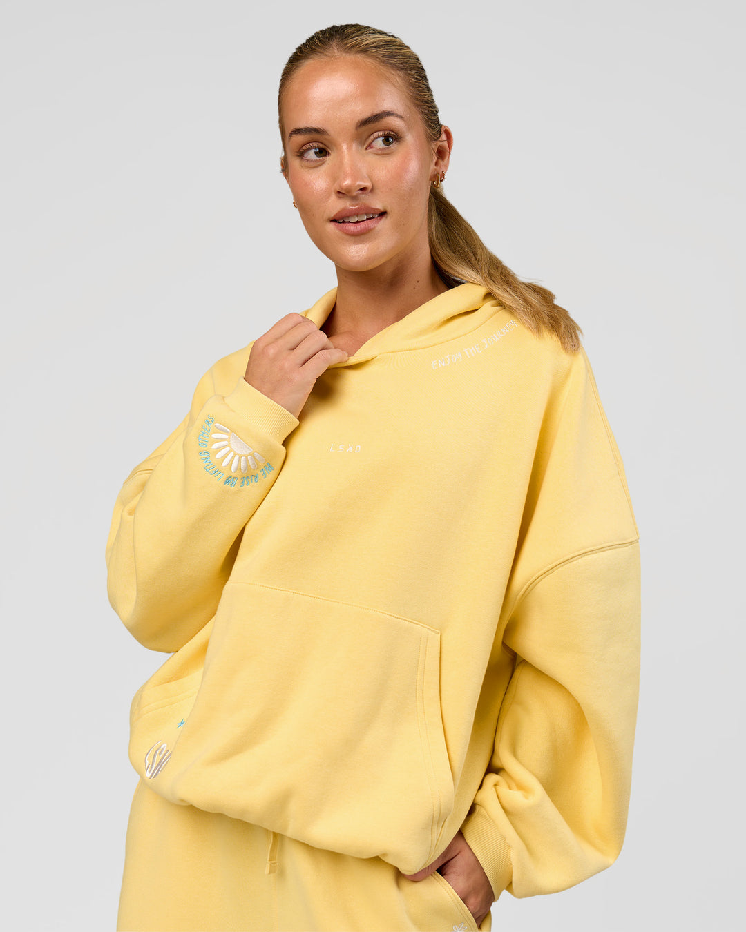 Woman wearing Zola Oversized Hoodie - Lemon | Model:Issy | Size:S - view 15