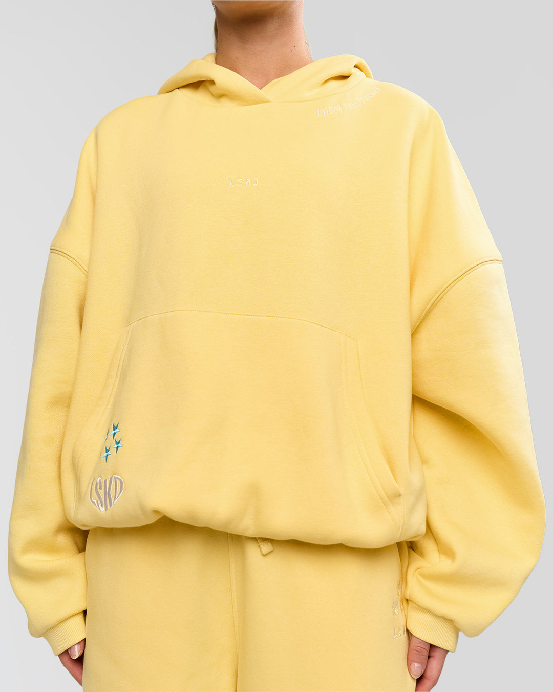 Woman wearing Zola Oversized Hoodie - Lemon | Model:Issy | Size:S - view 16