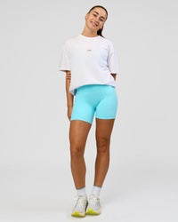 Woman wearing Run Like The Wind FLXCotton Oversized Tee - White-Future Navy | Model:Grace | SizeS | Thumbnail Index: 4