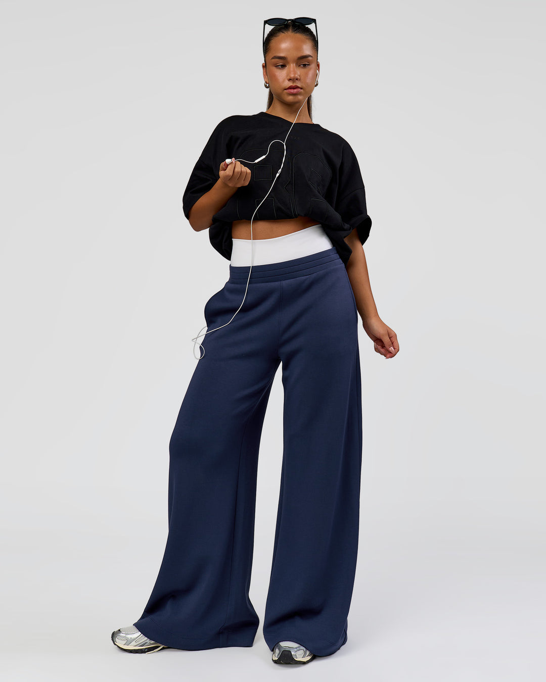 Woman wearing 86 V-Neck Oversized Tee - Black-Black | Model:Sophia | Size:S | - view 11