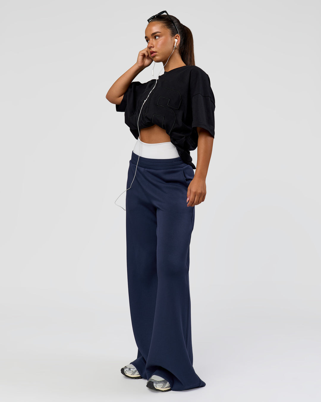 Woman wearing 86 V-Neck Oversized Tee - Black-Black | Model:Sophia | Size:S | - view 12