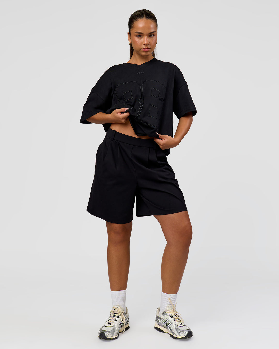 Woman wearing 86 V-Neck Oversized Tee - Black-Black | Model:Sophia | Size:S  - view 13