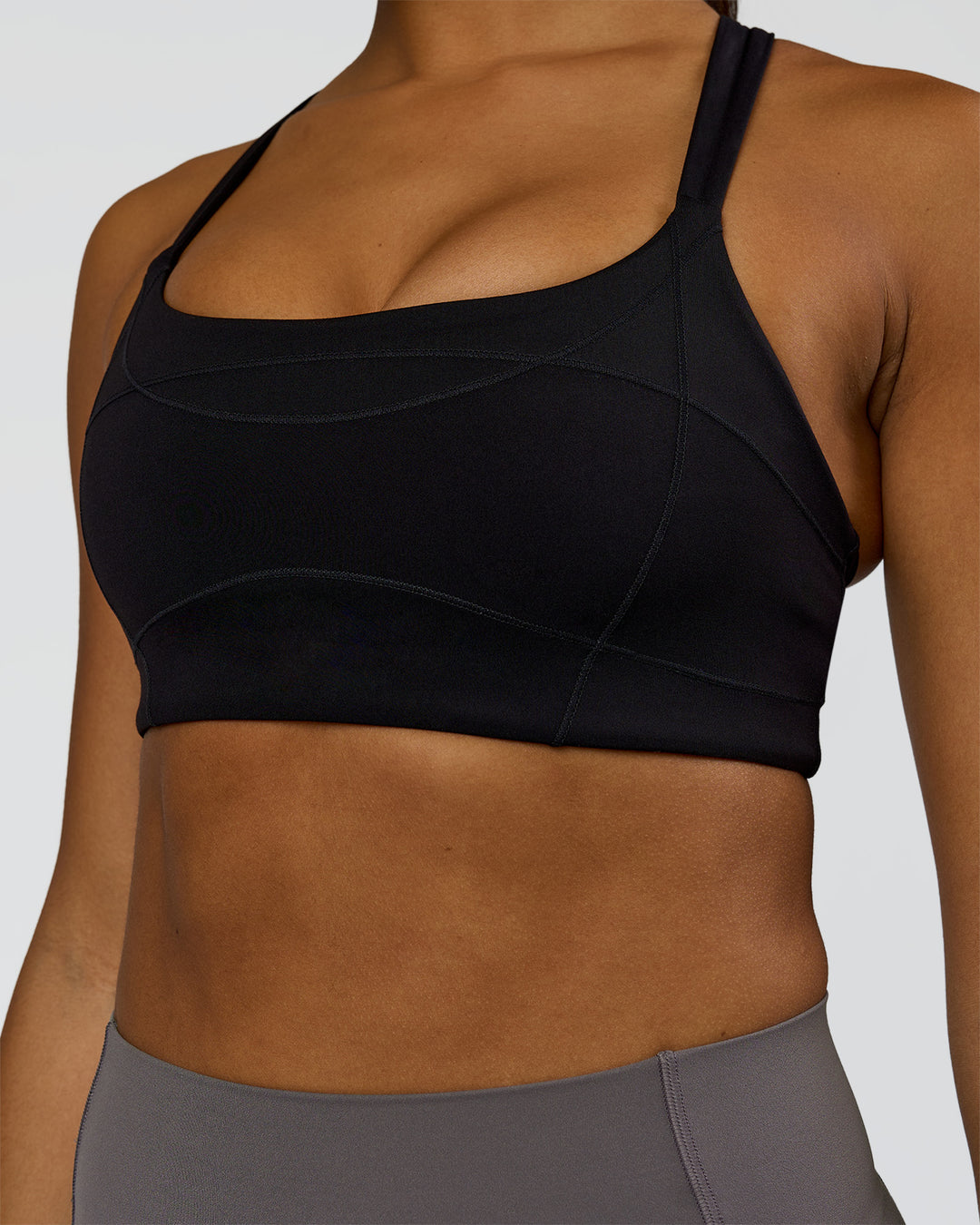 Woman wearing Inertia Sports Bra - Black | Model:Rosie | Size:S - view 6
