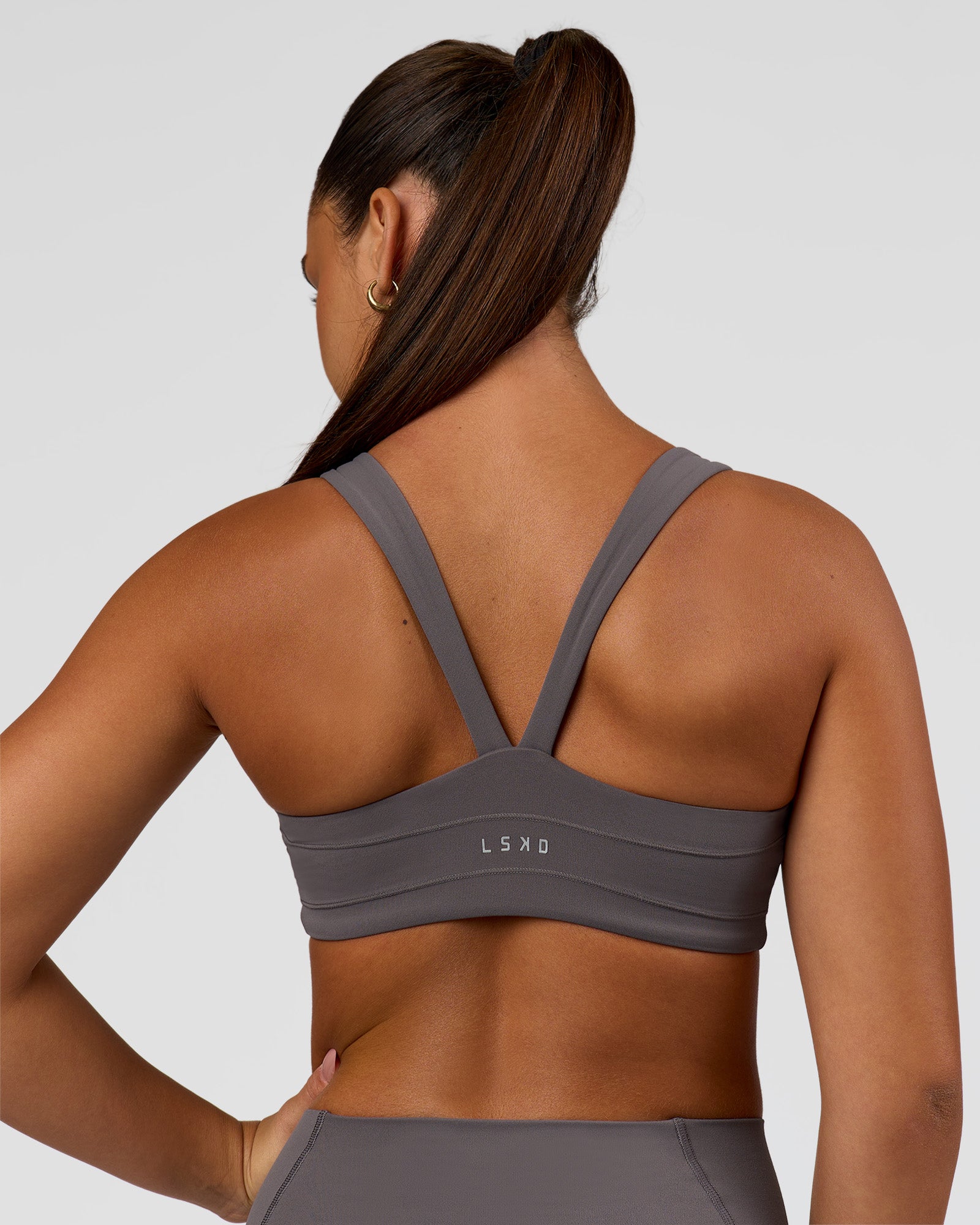 Woman wearing Inertia Sports Bra - Duskstone | Model:Rosie | Size:S
