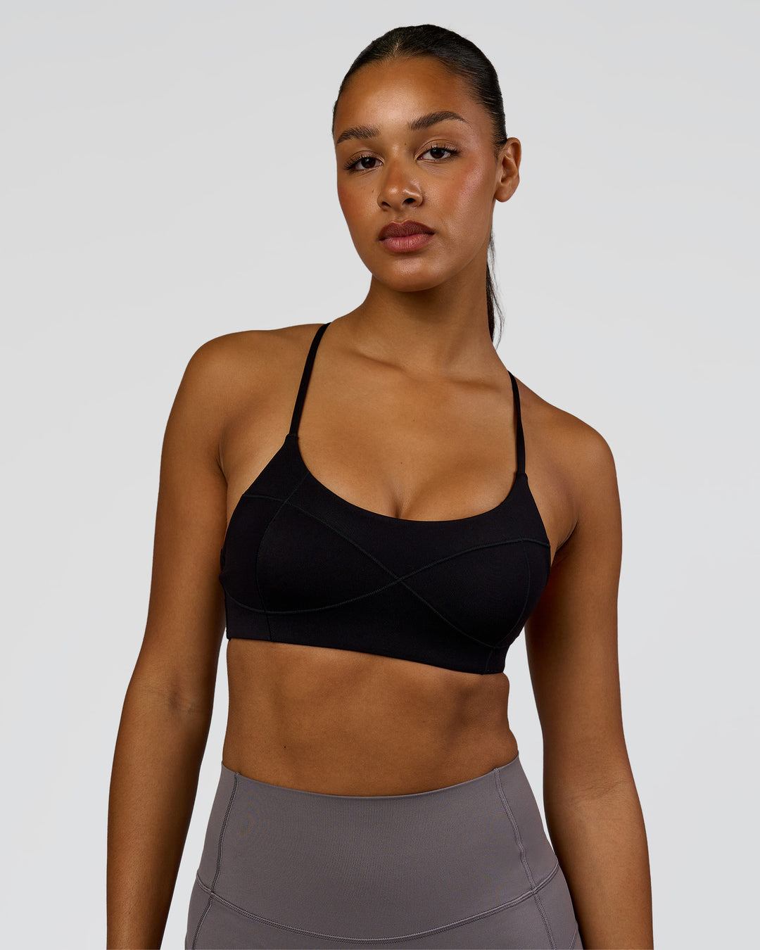 Woman wearing Infinite Contour Sports Bra - Black | Model:Rosie | Size:S - view 1