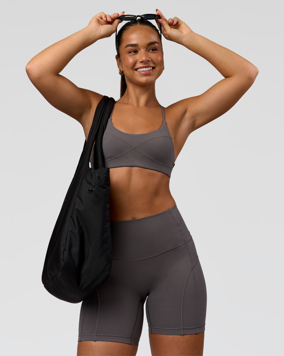 Woman wearing Infinite Contour Sports Bra - Duskstone | Model:Rosie | Size:S - view 1