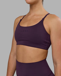 Woman wearing Twist Sports Bra - Midnight Plum | Thumbnail Index: 5