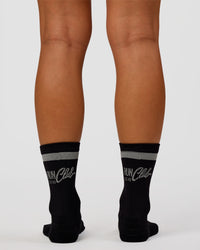 Woman wearing Run Club Fast Performance Socks 2.0 - Black-Reflective | Thumbnail Index: 7