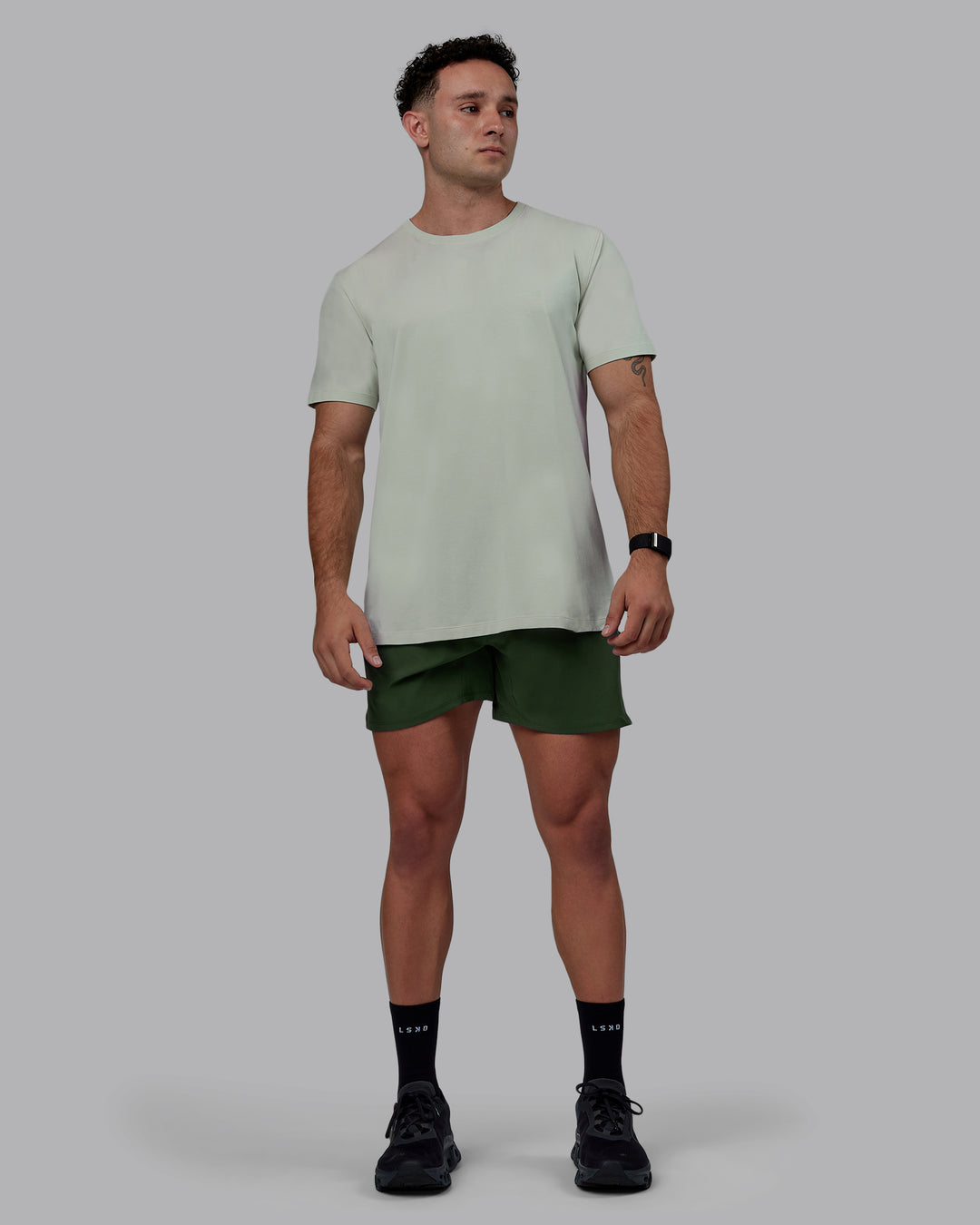 Man wearing Challenger 6" Performance Shorts - Cilantro - view 3