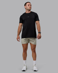 Man wearing Challenger 6" Performance Shorts - Sustained Grey | Thumbnail Index: 2