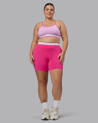 Woman wearing Excel Ultra High-Rise 6" Short - Ultra Pink | Thumbnail Index: 5