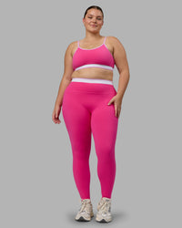 Woman wearing Excel Sports Bra - Ultra Pink | Thumbnail Index: 3