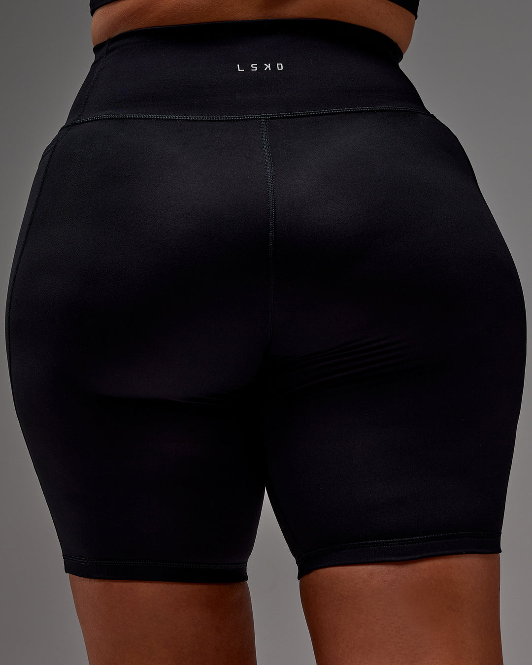 Woman wearing Fusion Ultra High-Rise 9" Short Pockets - Black | Model:Aimee | Size:XL - view 39