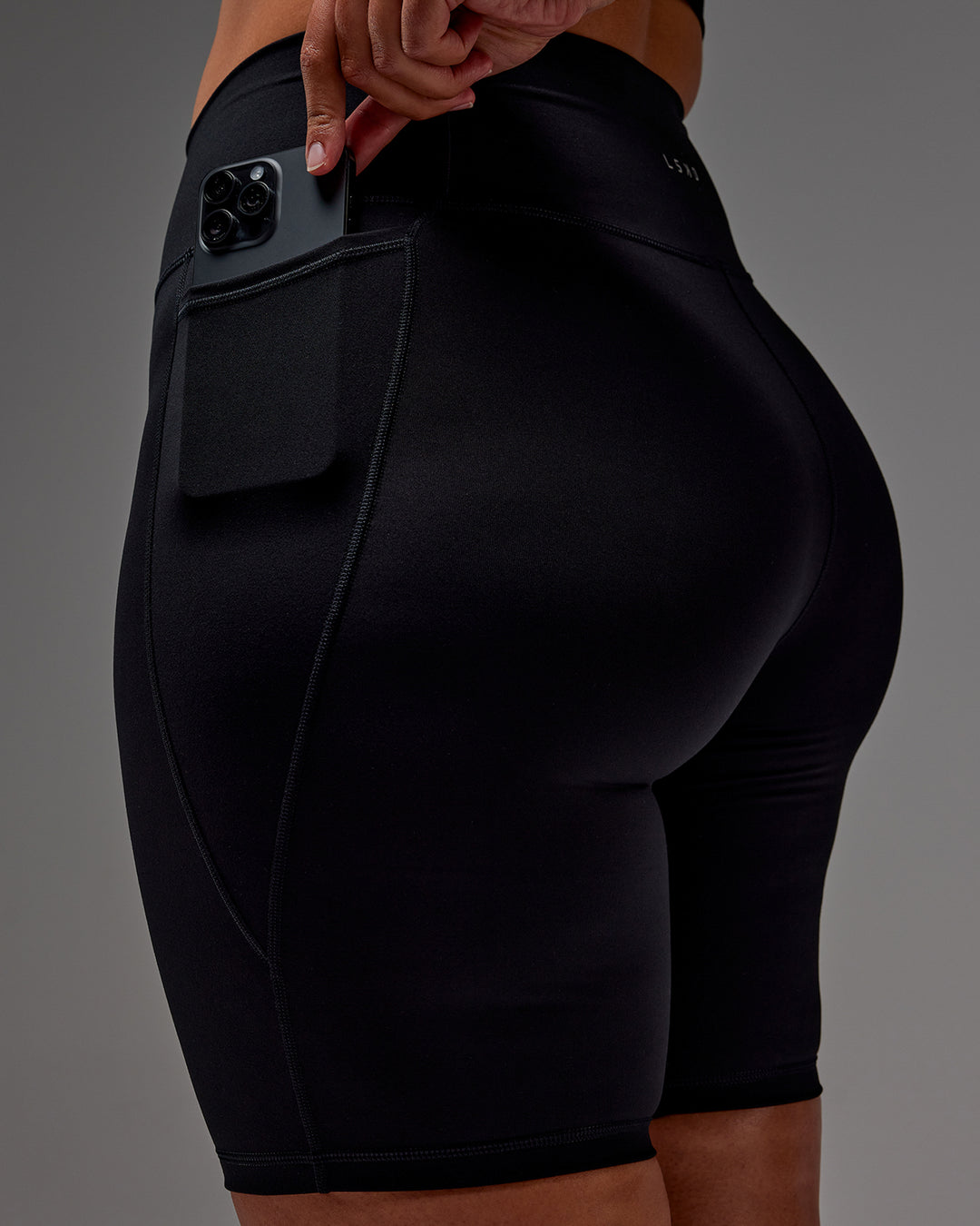 Woman wearing Fusion Ultra High-Rise 9" Short Pockets - Black | Model:Aimee | Size:XL - view 35