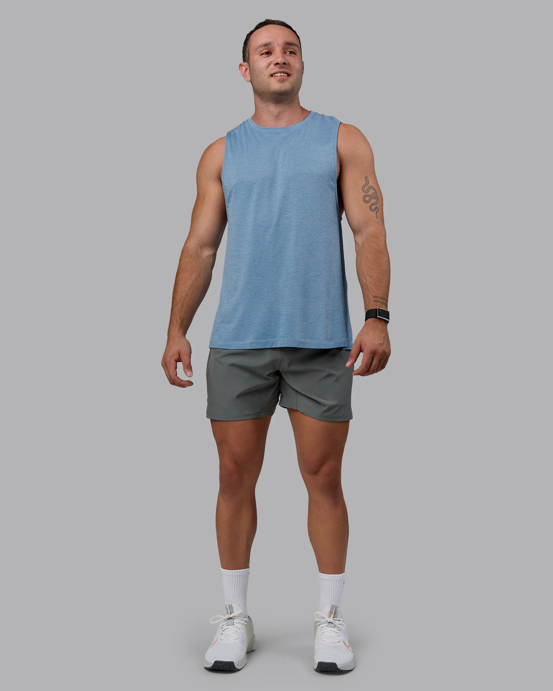 Man wearing AeroFLX+ Seamless Muscle Tank - Elemental Blue/Ice Blue - view 5