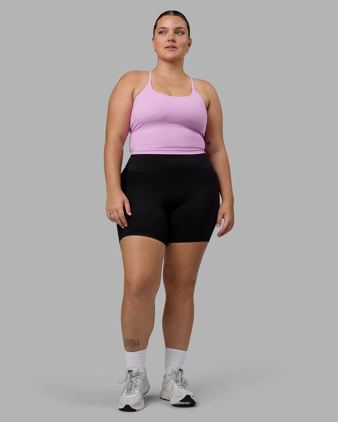 Woman wearing Twist Shelf Bra Tank - Pastel Orchid - view 4