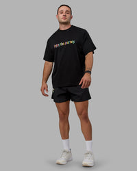 Man wearing Unisex Enjoy The Journey Heavyweight Tee Oversize - Black-Multi | Thumbnail Index: 9
