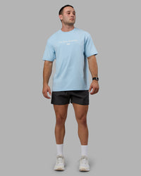 Man wearing Unisex Just Keep Running FLXCotton Tee Oversize - Glacial Blue-Off White | Thumbnail Index: 10