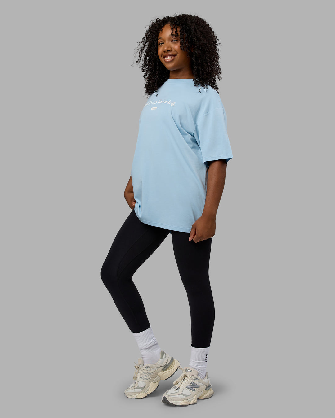 Woman wearing Unisex Just Keep Running FLXCotton Tee Oversize - Glacial Blue-Off White - view 3