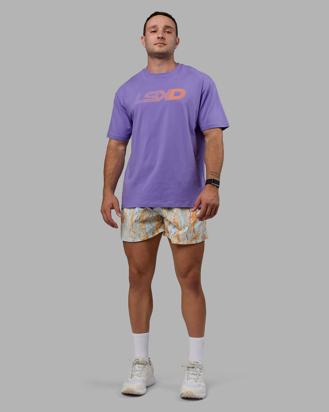 Man wearing Unisex Motion FLXCotton Tee Oversize - Dahlia Purple-Vibrant Orange - view 6