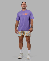 Man wearing Unisex Motion FLXCotton Tee Oversize - Dahlia Purple-Vibrant Orange | Thumbnail Index: 5