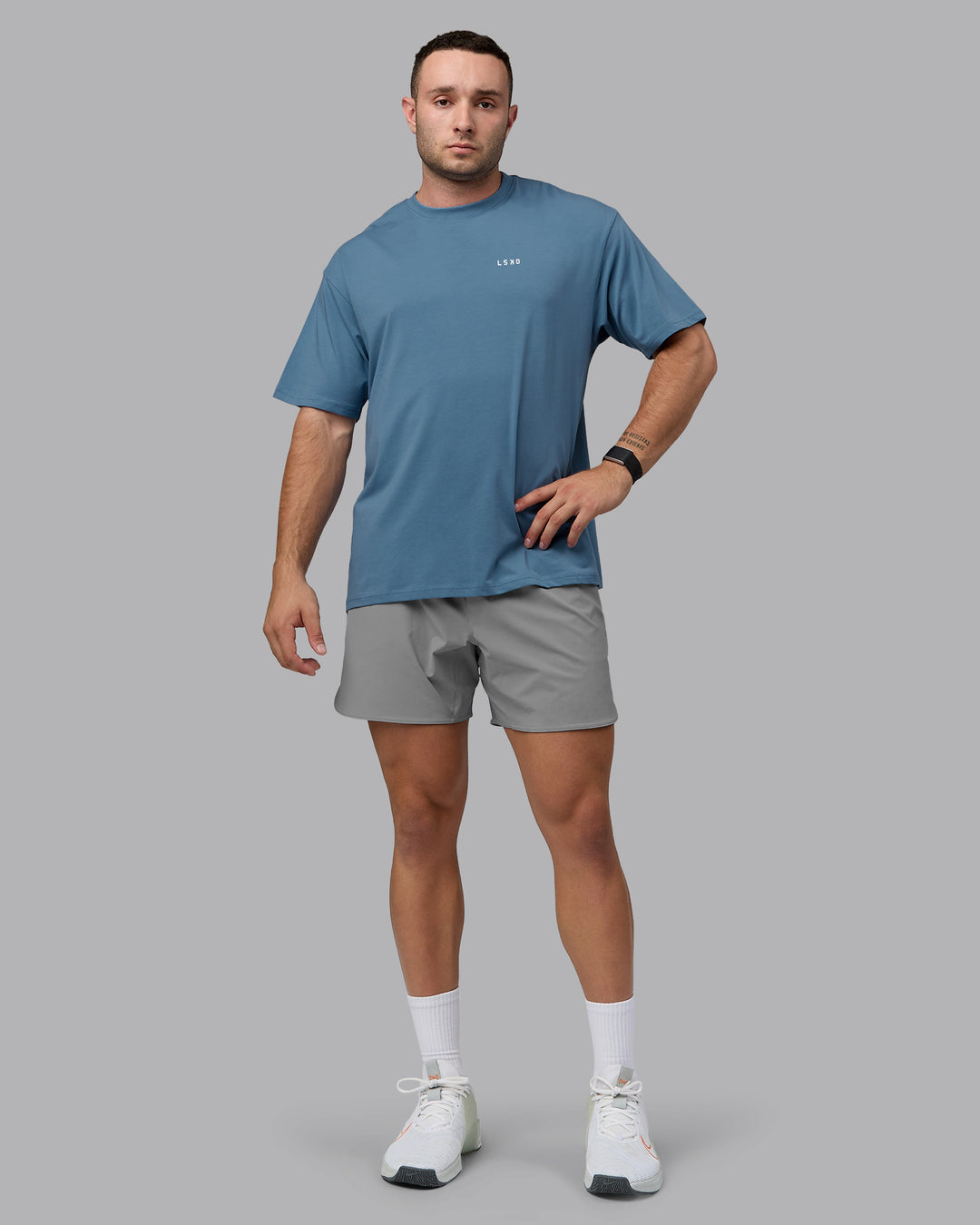 Man wearing Unisex Move Fast Value Series FLXCotton Tee Oversize - Elemental Blue-Off White - view 10