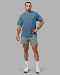 Man wearing Unisex Move Fast Value Series FLXCotton Tee Oversize - Elemental Blue-Off White | Thumbnail Index: 9