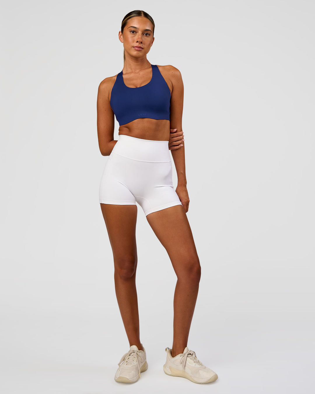 Woman wearing Stability High Support Sports Bra - Midnight Blue | Model:Charli | Size:XS (A-C Cup) - view 3
