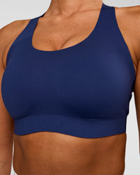 Woman wearing Stability High Support Sports Bra - Midnight Blue | Model:Charli | Size:XS (A-C Cup) | Thumbnail Index: 3