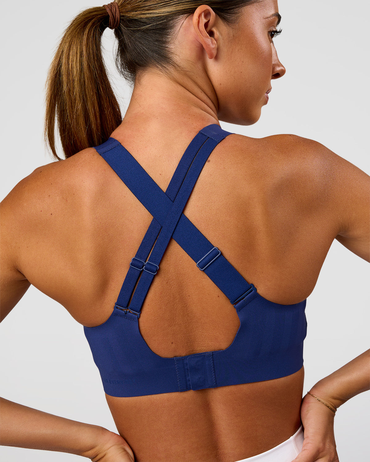 Woman wearing Stability High Support Sports Bra - Midnight Blue | Model:Charli | Size:XS (A-C Cup)