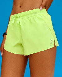 Woman wearing Accelerate 3" Running Short - Lime Glo | Model:Txai | Size:XS | Thumbnail Index: 1