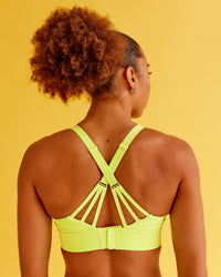 Woman wearing Accelerate Split Strap Sports Bra - Hyper Green | Model:Txai | Size:XS | Thumbnail Index: 5