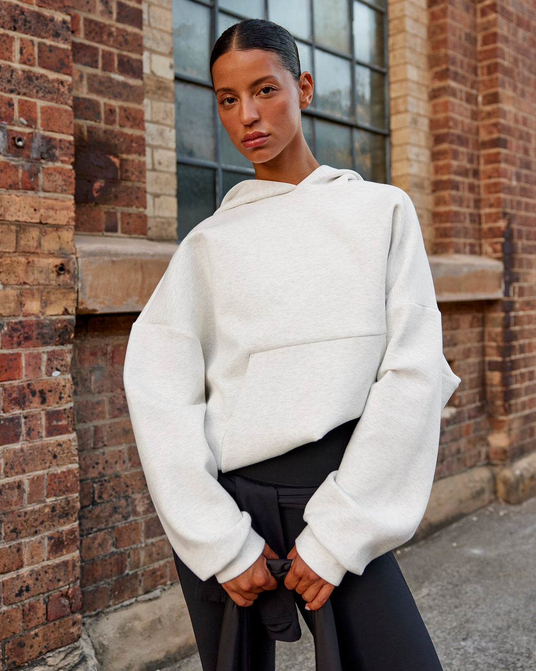 Woman wearing AfterDark ZeroCrease Oversized Hoodie - Silver Marl | Model:Nejilka |Size:XS - view 9