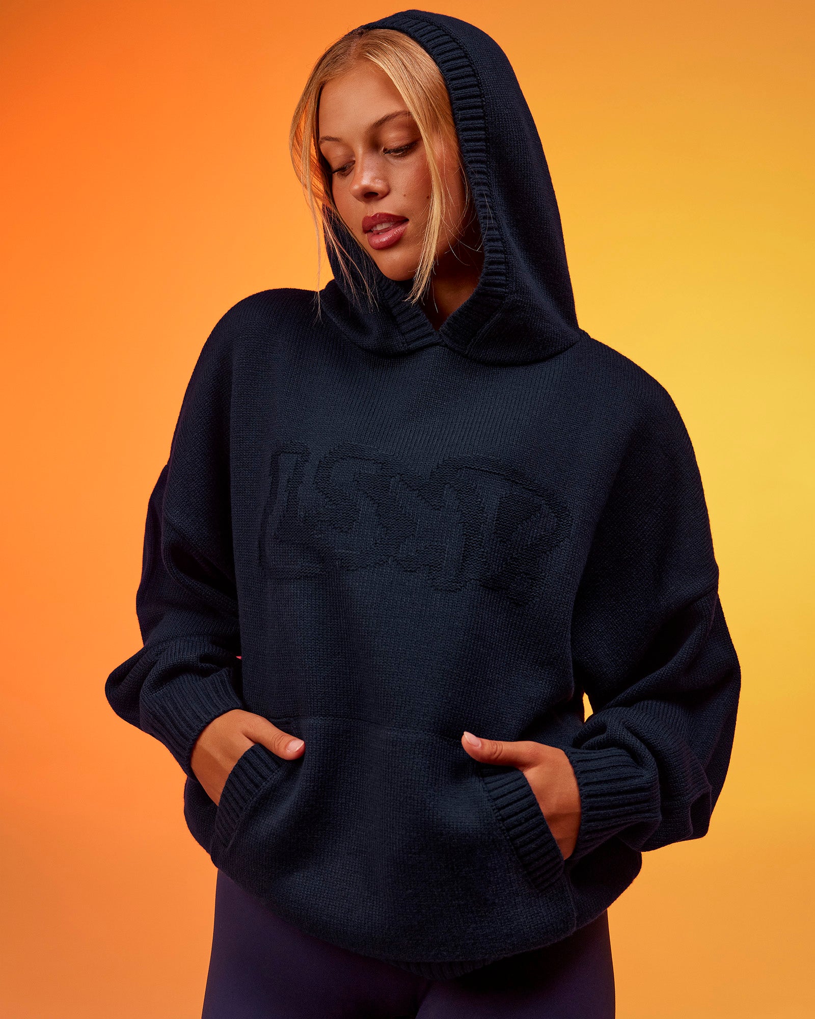 Woman wearing All Day Active Knitted Hoodie - Future Navy | Model:Hailey | Size:XS