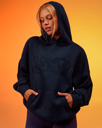 Woman wearing All Day Active Knitted Hoodie - Future Navy | Model:Hailey | Size:XS | Thumbnail Index: 1