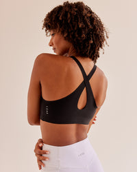 Woman wearing Bend & FLX Plunge Sports Bra - Black | Model:Tomi | Size:XS | Thumbnail Index: 2