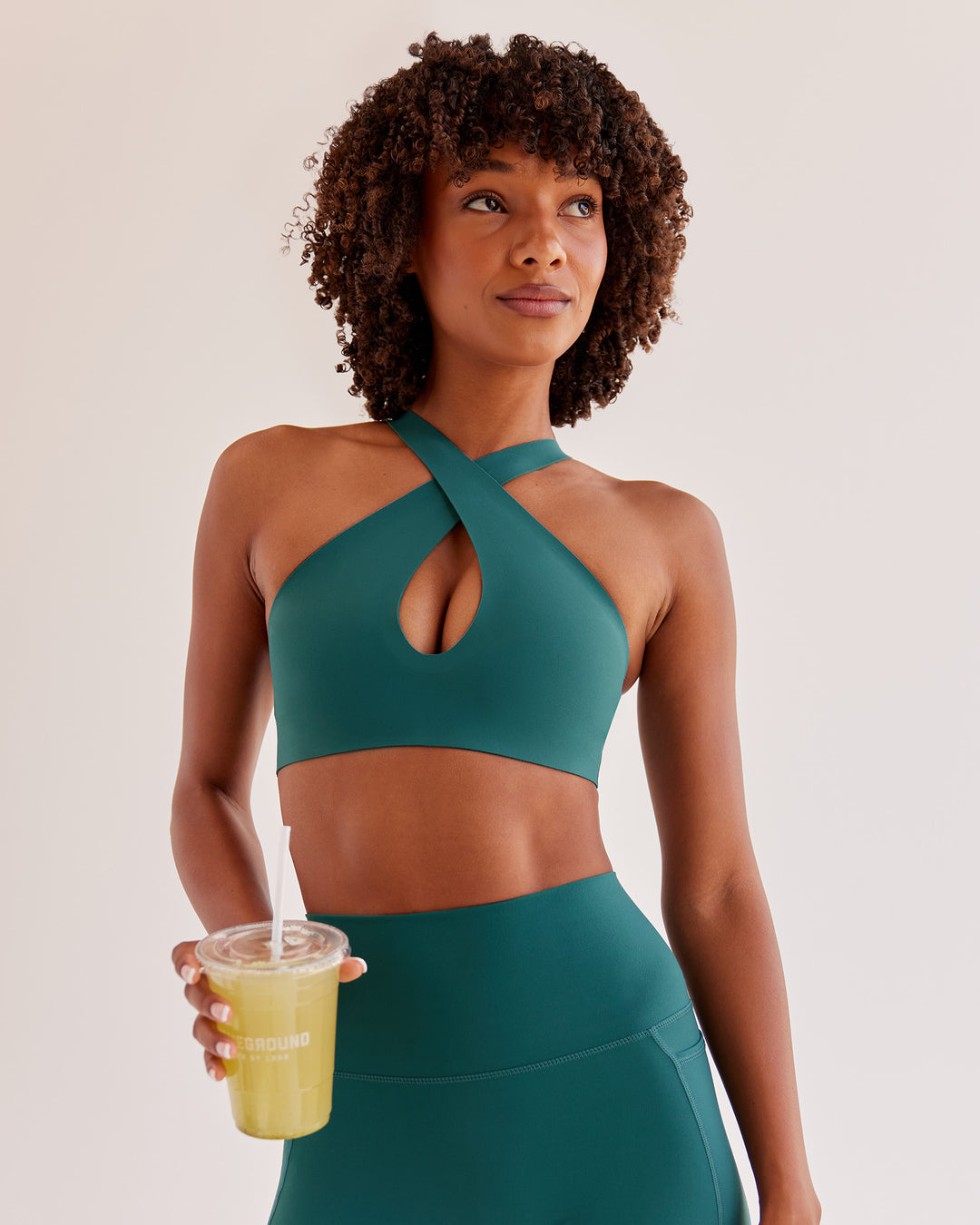 Woman wearing Bend &amp; FLX Plunge Sports Bra - Transformative Teal | Model:Tomi | Size:XS - view 1