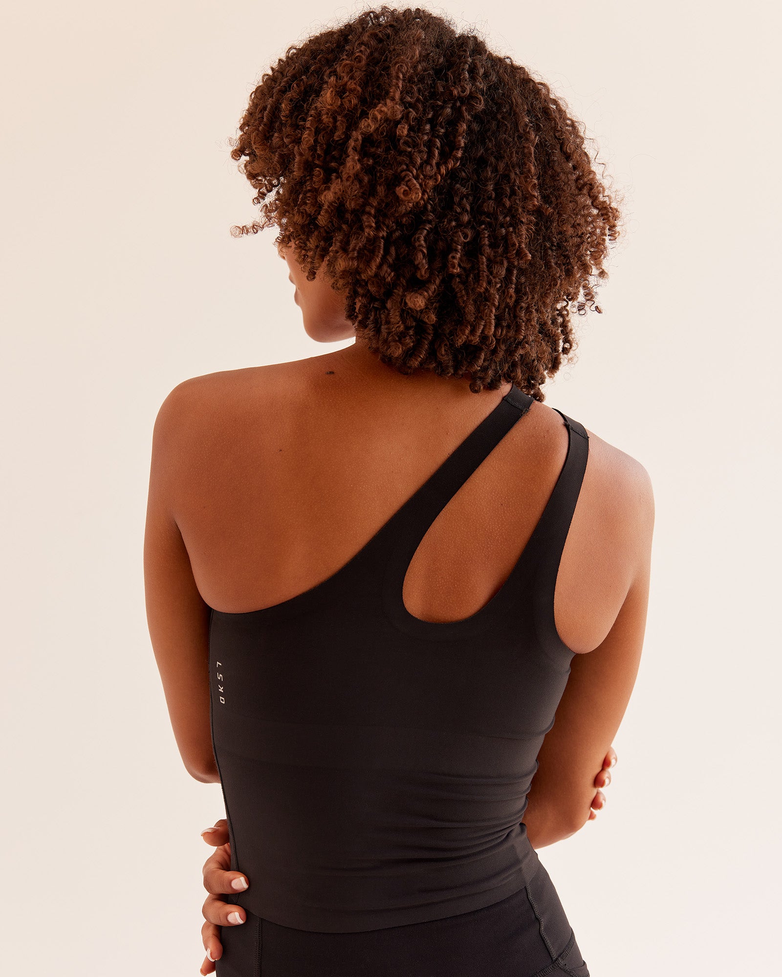 Woman wearing Bend & FLX Plunge Tank - Black | Model:Tomi | Size:XS