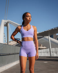 Woman wearing Elixir Ultra High-Rise 4" Short - Violet Ray | Model:Txai | Size:XS | Thumbnail Index: 3
