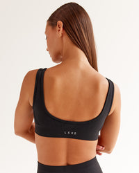 Woman wearing Ember Seamless Sports Bra - Black | Model:Brylee | Size:XS | Thumbnail Index: 1