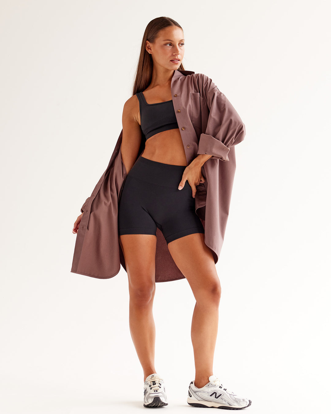 Woman wearing Ember Seamless Sports Bra - Black | Model:Brylee | Size:XS - view 5