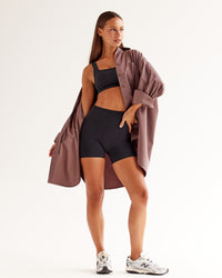 Woman wearing Ember Seamless Sports Bra - Black | Model:Brylee | Size:XS | Thumbnail Index: 4