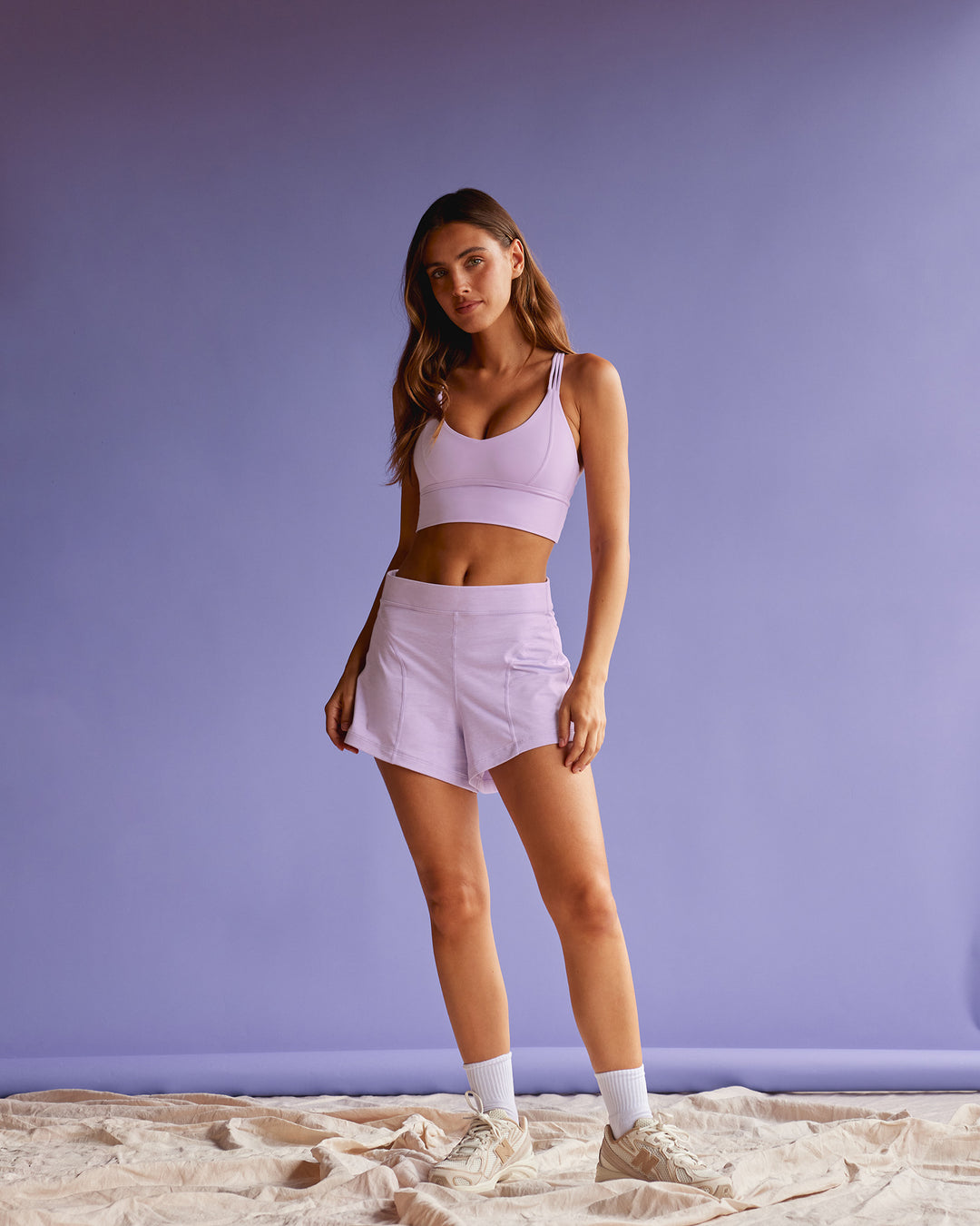 Woman wearing Flash Longline Sports Bra - Pale Lilac | Model:Beatriz | Size:XS - view 4