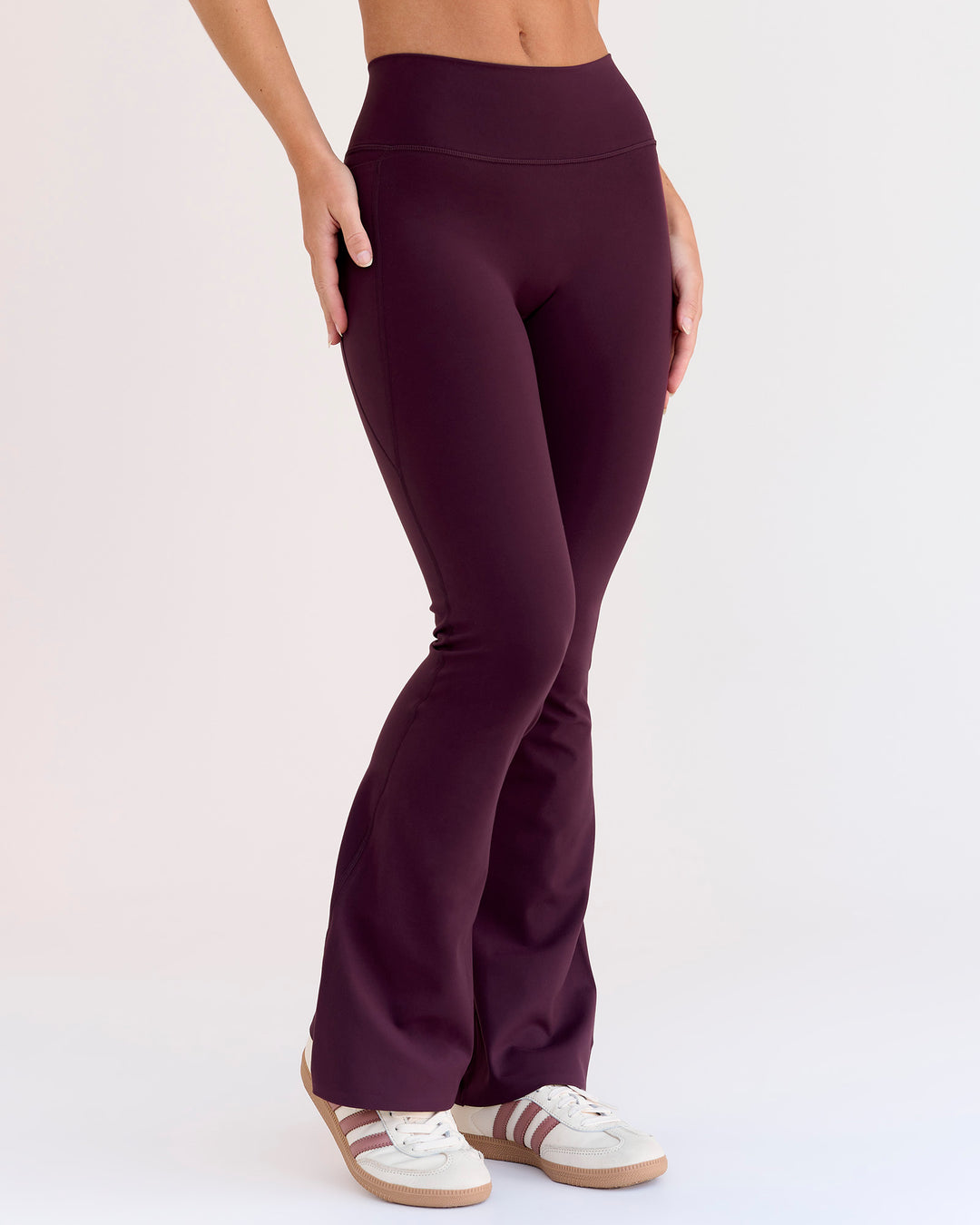 Woman wearing Fusion V-Contour High-Rise Flared Petite Legging Pockets - Cherry Lacquer | Model:Issy | Size:XS - view 10