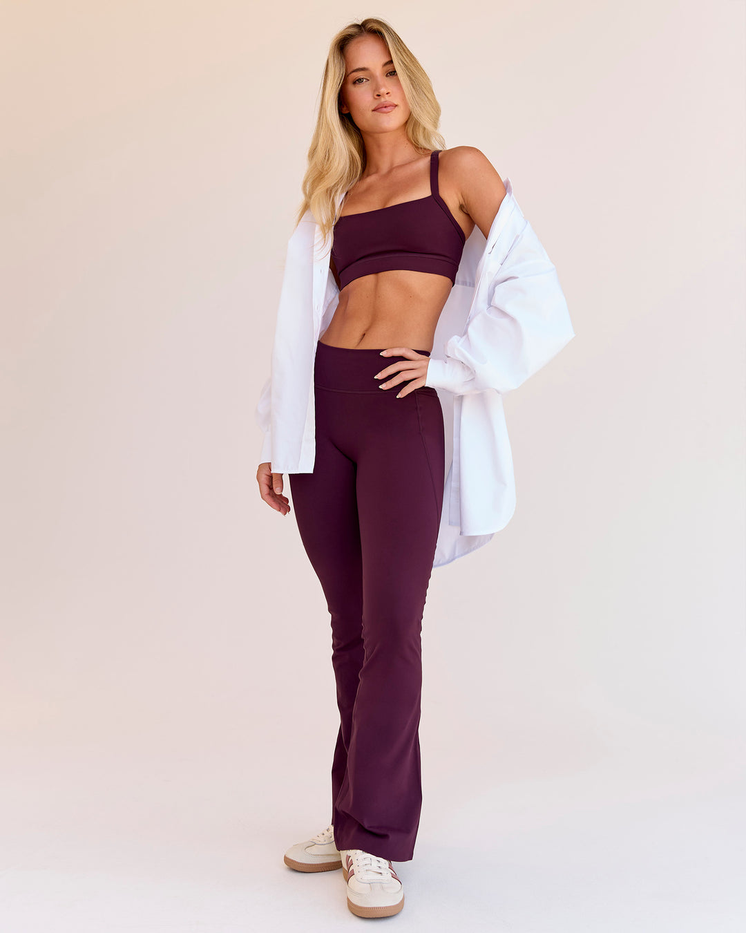 Woman wearing Fusion V-Contour High-Rise Flared Petite Legging Pockets - Cherry Lacquer | Model:Issy | Size:XS - view 3