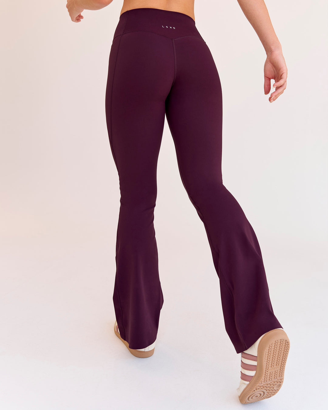 Woman wearing Fusion V-Contour High-Rise Flared Petite Legging Pockets - Cherry Lacquer | Model:Issy | Size:XS - view 4