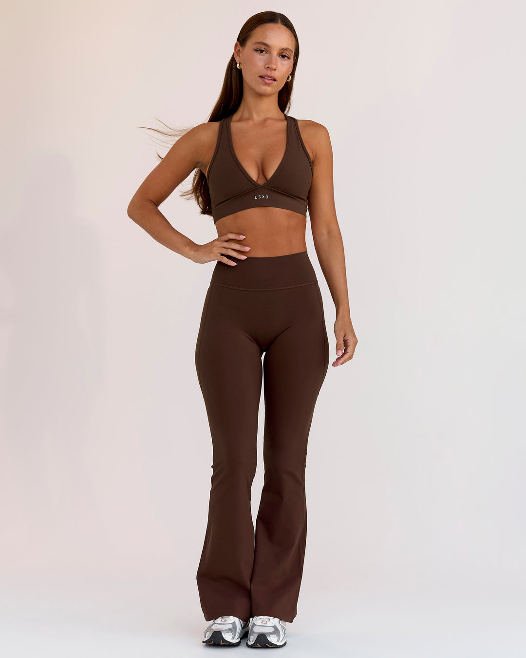 Woman wearing Fusion V-Contour High-Rise Flared Petite Legging Pockets - Hot Chocolate | Model:Brylee | Size:XS - view 10
