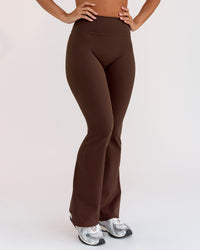 Woman wearing Fusion V-Contour High-Rise Flared Petite Legging Pockets - Hot Chocolate | Model:Brylee | Size:XS | Thumbnail Index: 5