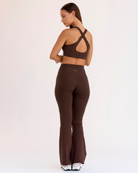 Woman wearing Fusion V-Contour High-Rise Flared Petite Legging Pockets - Hot Chocolate | Model:Brylee | Size:XS | Thumbnail Index: 2
