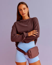 Woman wearing Go-To Long Sleeve FLXCotton Oversized Tee - Cocoa Powder-White | Model:Brylee | Size:XS | Thumbnail Index: 0